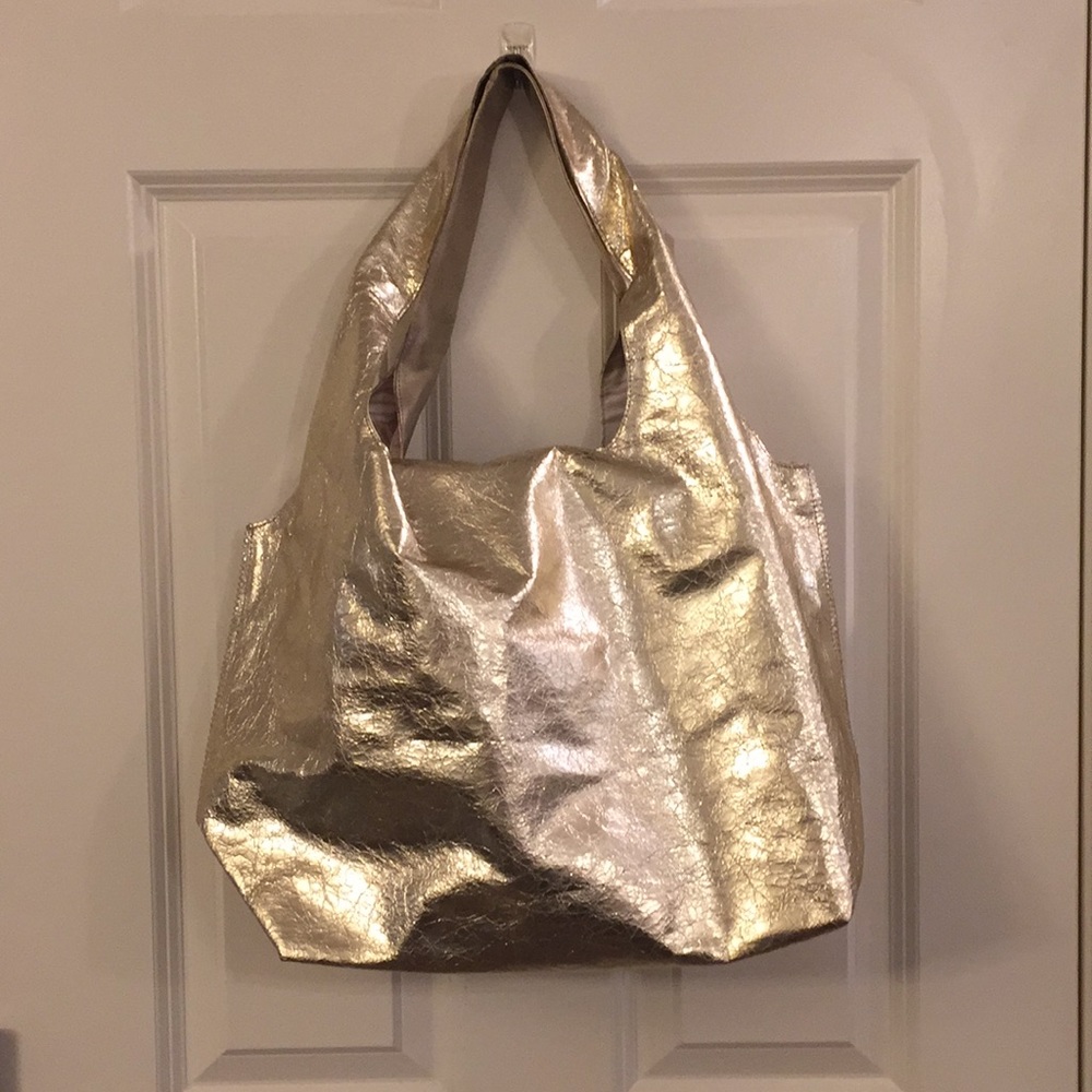 Stella and Dot gold switcharoo tote.